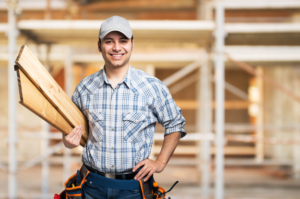 Portrait of a smiling carpenter in construction site